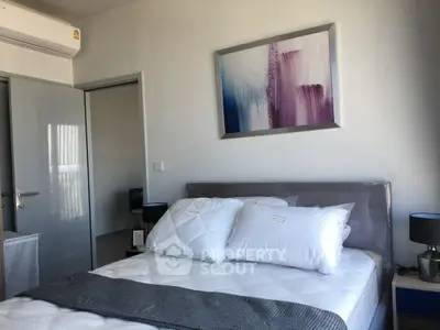 Modern bedroom with stylish decor and air conditioning, perfect for comfort and relaxation.