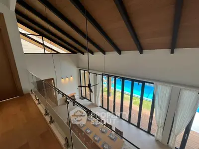 Stunning open-plan living area with pool view and elegant dining setup