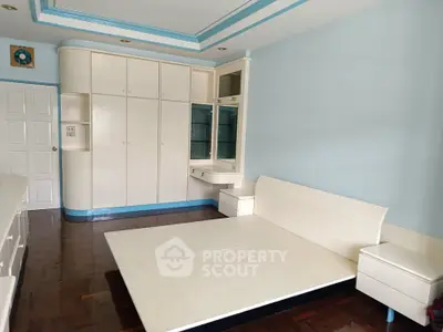 Spacious bedroom with built-in storage and modern design