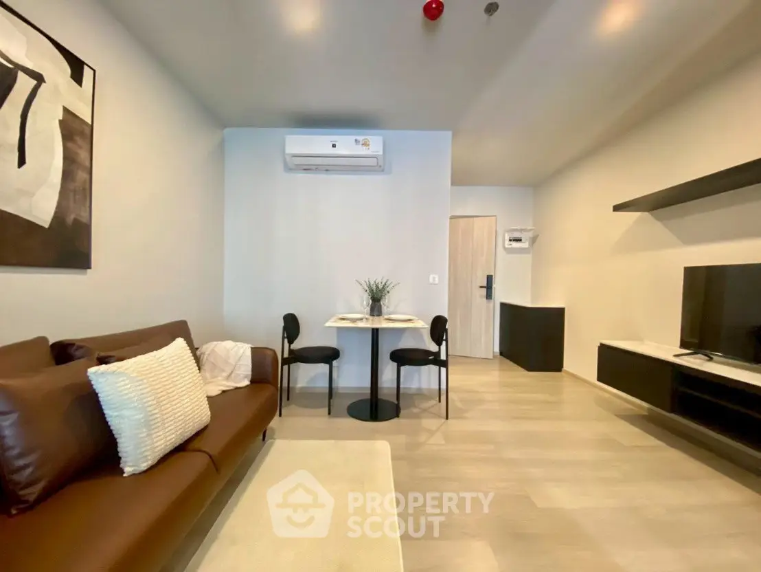 Modern living room with sleek furniture and air conditioning