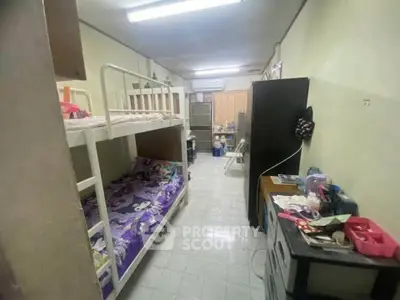 Cozy bedroom with bunk beds and ample storage in a compact layout, ideal for maximizing space efficiency.