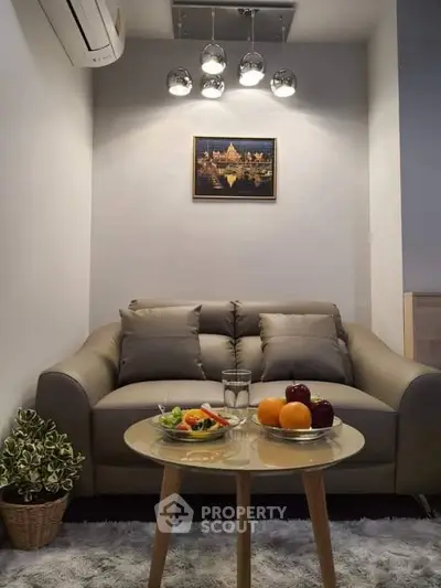 Cozy living room with modern sofa and stylish lighting, perfect for relaxation.