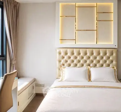 Luxurious bedroom with elegant lighting and plush headboard, perfect for relaxation and comfort.