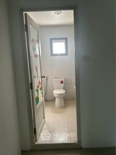 Cozy bathroom with natural light and simple decor, perfect for a minimalist lifestyle.