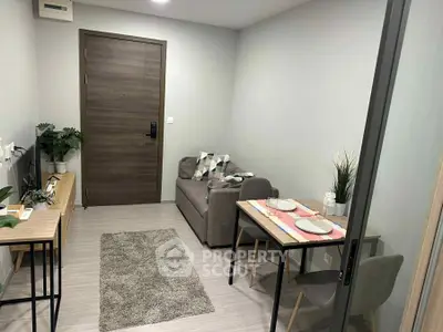 Modern living room with cozy sofa and dining area in stylish apartment.