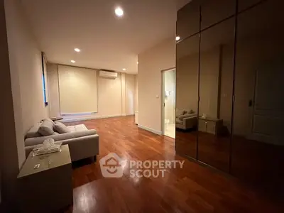 Spacious living room with wooden flooring and modern decor