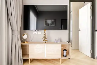 Modern living room with sleek TV setup and stylish decor