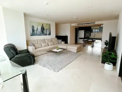 Spacious modern living room with open kitchen and elegant decor