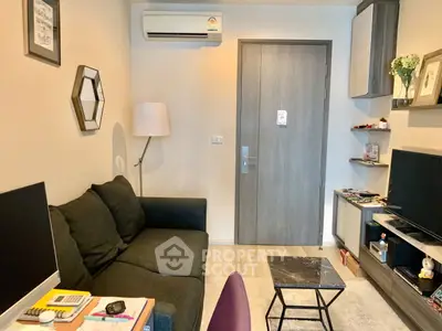 Cozy living room with modern decor and air conditioning, perfect for relaxation.