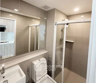 Modern bathroom with sleek shower and elegant fixtures