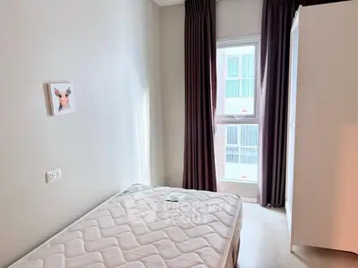 Cozy bedroom with natural light and minimalist decor