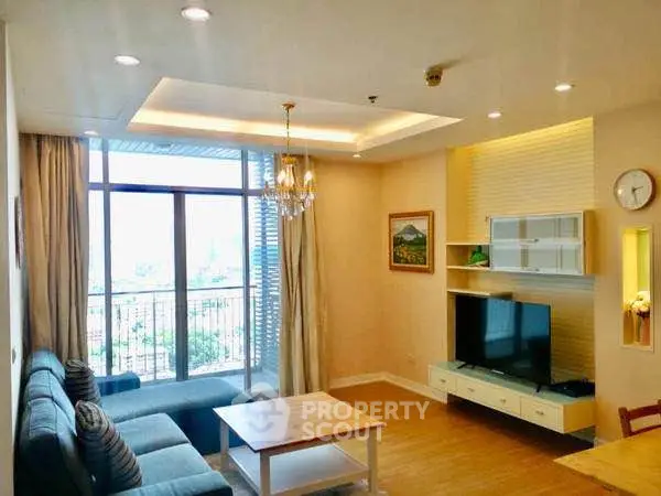 Bright and spacious living room with modern decor and city view balcony.