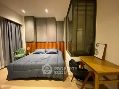 Modern bedroom with stylish decor, featuring a cozy bed, elegant desk, and ambient lighting.