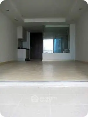 Spacious modern living room with open layout and large windows