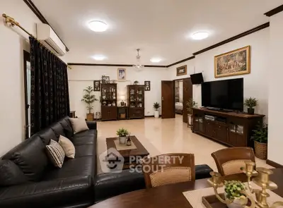 Spacious living room with elegant decor and modern furnishings, perfect for family gatherings.