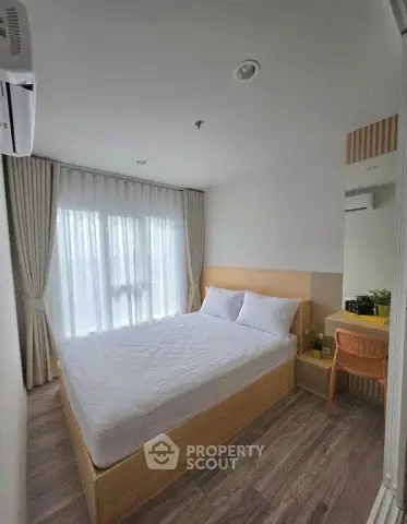 Modern bedroom with natural light and minimalist design