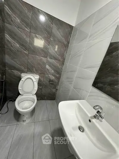 Modern bathroom with sleek tiles and contemporary fixtures