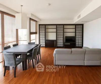 Spacious modern living room with elegant dining area and natural light