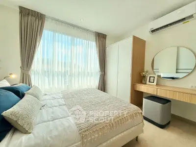 Bright and cozy bedroom with modern decor and large window