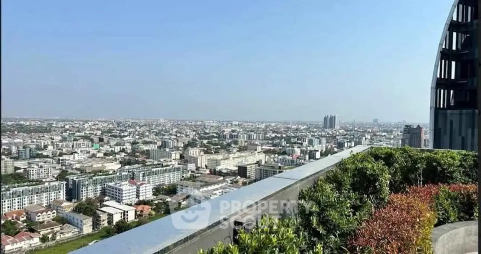 Stunning cityscape view from a high-rise rooftop garden, showcasing urban living at its finest.