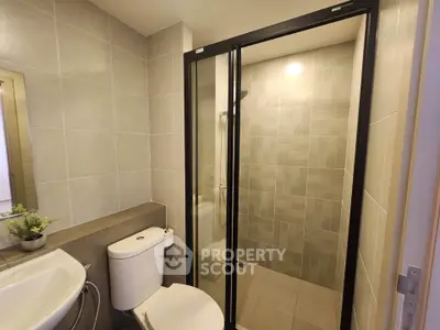 Modern bathroom with sleek shower enclosure and elegant tile design