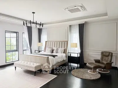 Luxurious master bedroom with elegant decor and natural light