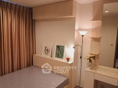 Cozy bedroom with modern decor and elegant lighting, perfect for relaxation and comfort.