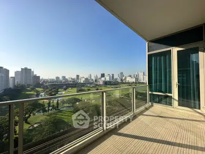 Spacious balcony with stunning city skyline and golf course view, perfect for relaxation and entertainment.