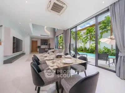 Luxurious open-plan living room with pool view and modern dining area