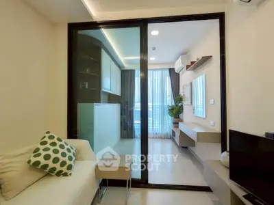 Modern living room with sliding glass doors and stylish decor