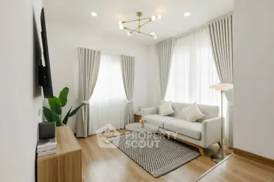 Elegant modern living room with stylish decor and natural light