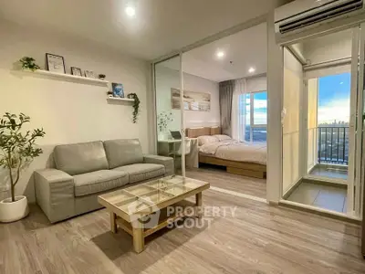 Modern living room with cozy bedroom and balcony view
