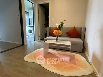 Cozy living room with modern decor and washing machine in view
