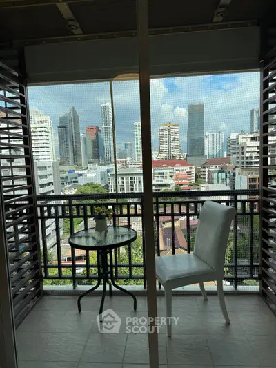 Charming balcony with city skyline view, perfect for relaxation and enjoying urban scenery.