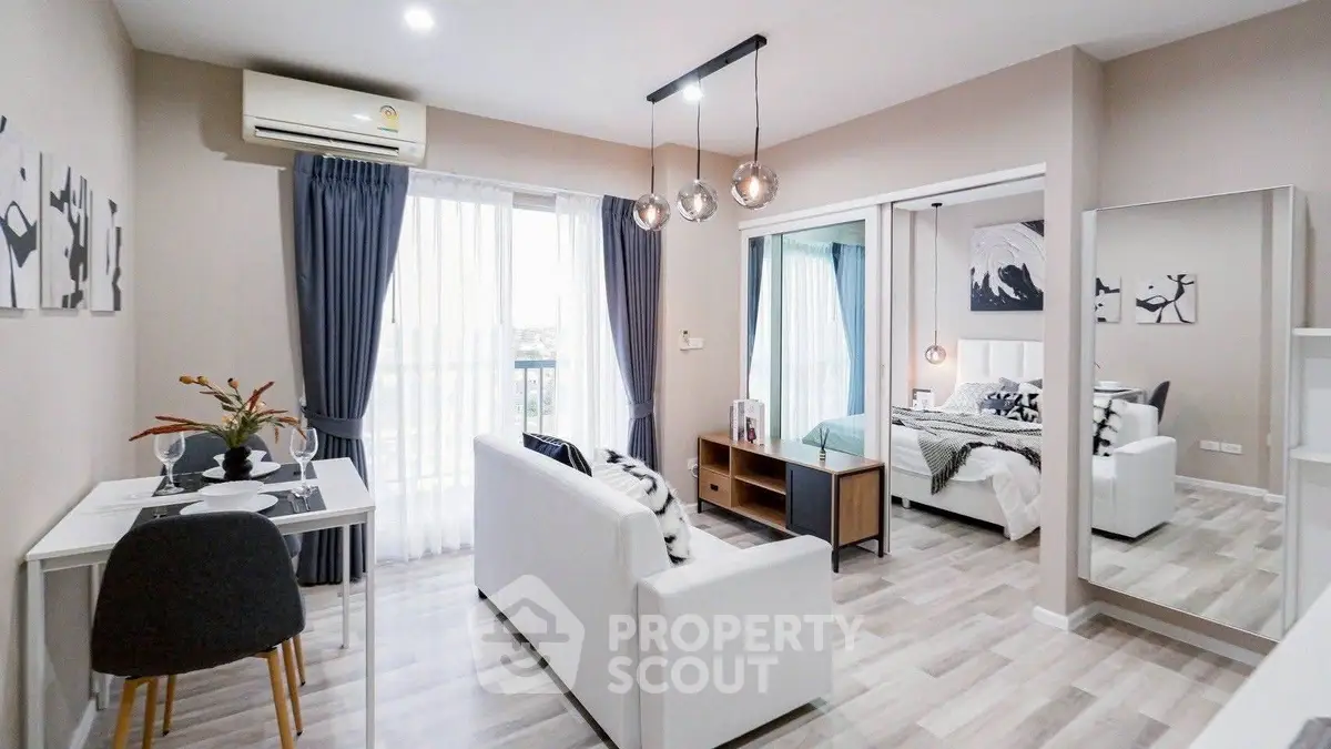 Modern open-plan living room with stylish decor and natural light