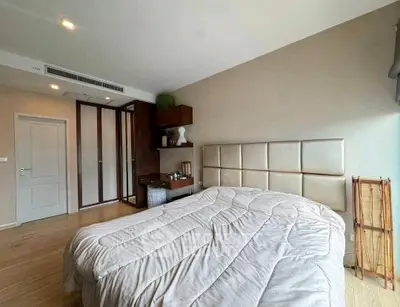 Spacious bedroom with modern decor and ample natural light