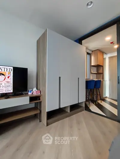 Modern apartment interior with sleek wardrobe and stylish bar stools