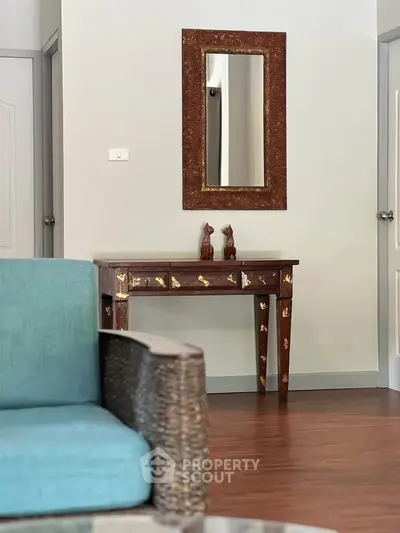 Charming interior with elegant wooden console table and decorative mirror