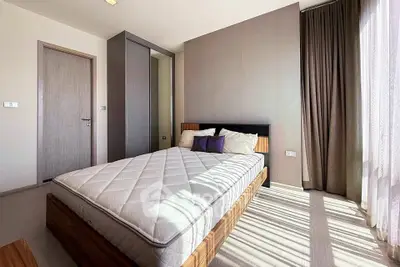 Spacious bedroom with modern design and ample natural light