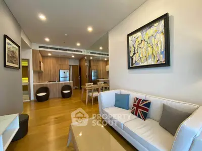 Modern living room with stylish decor and open kitchen layout in a contemporary apartment.