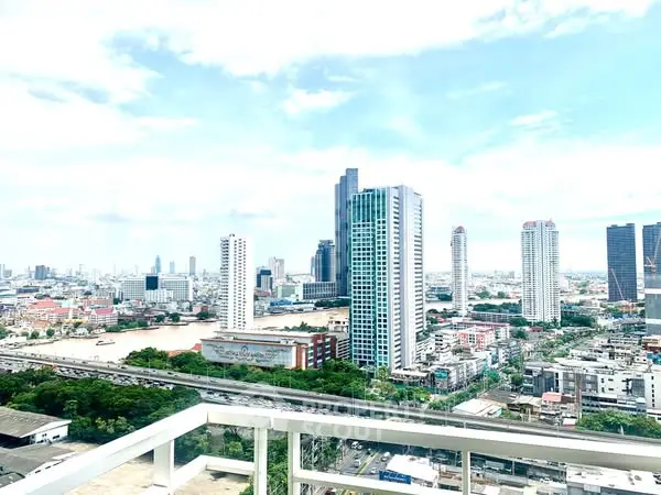 Stunning cityscape view from high-rise balcony with modern skyline and river.