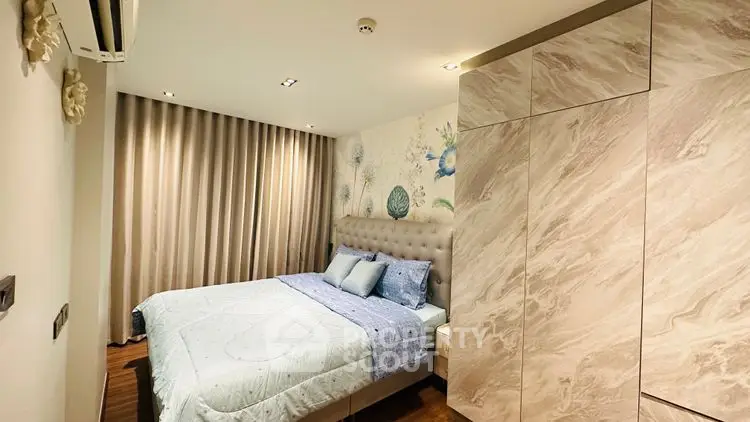 Cozy bedroom with elegant decor and ample storage space