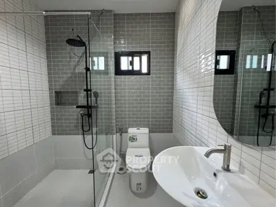 Modern bathroom with sleek shower and stylish tiles