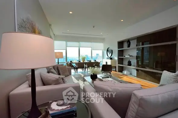 Luxurious modern living room with elegant decor and stunning city view.