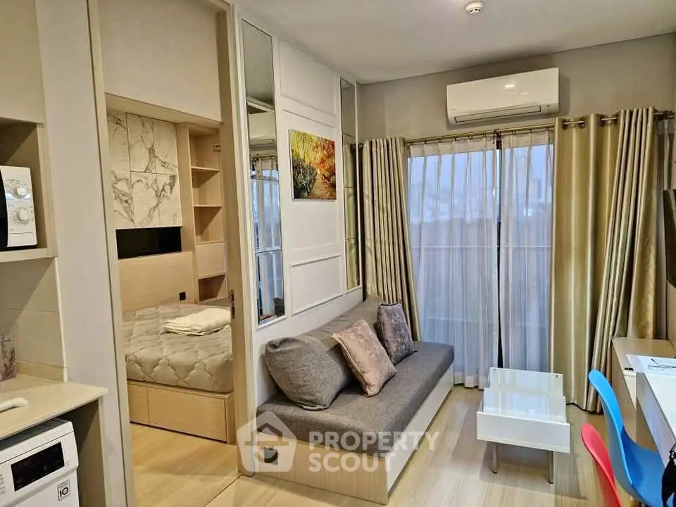 Modern compact living room with cozy sofa and stylish decor