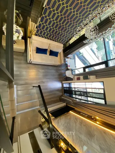 Luxurious modern living room with high ceiling and elegant decor