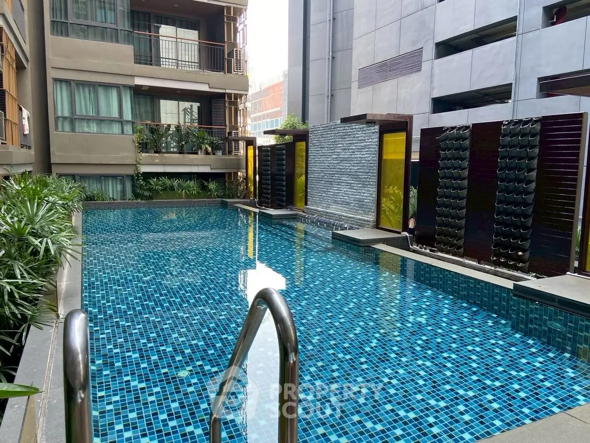 Luxurious modern apartment pool with elegant design and serene ambiance.
