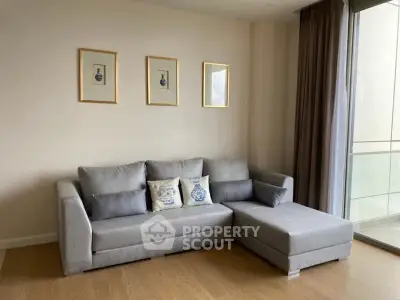 Modern living room with stylish gray sectional sofa and elegant decor