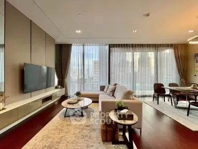 Luxurious modern living room with elegant decor and city view, featuring a spacious seating area and dining space.
