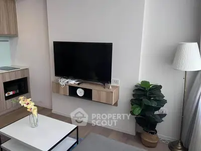 Modern living room with wall-mounted TV and stylish decor